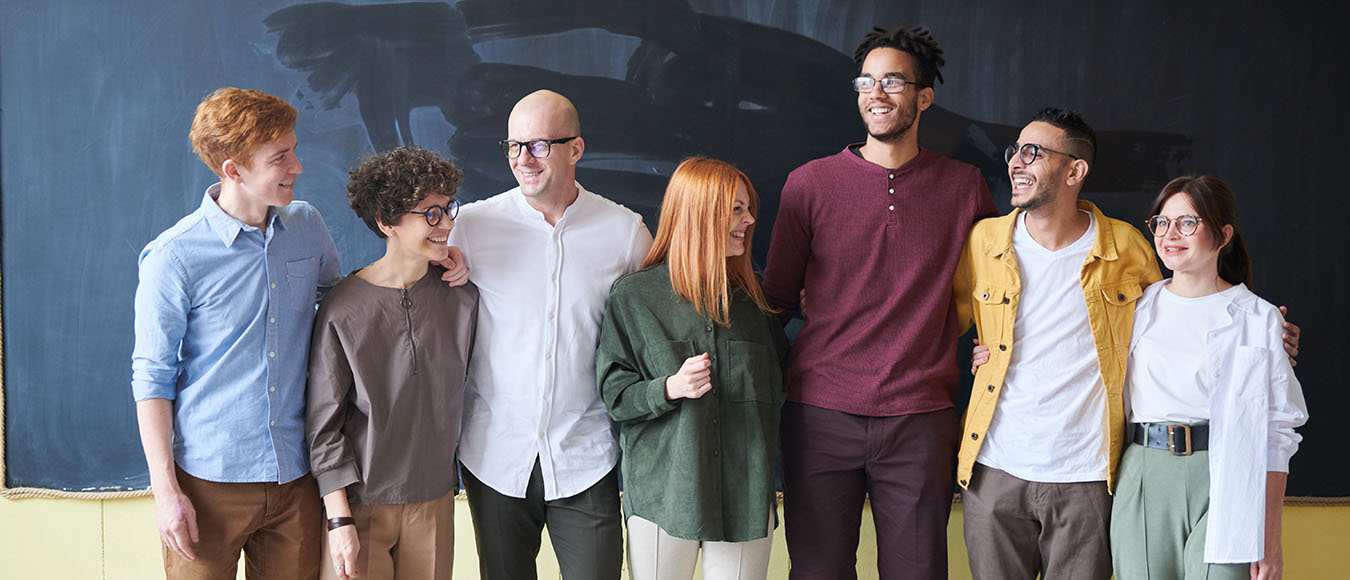 office employees standing by chalkboard