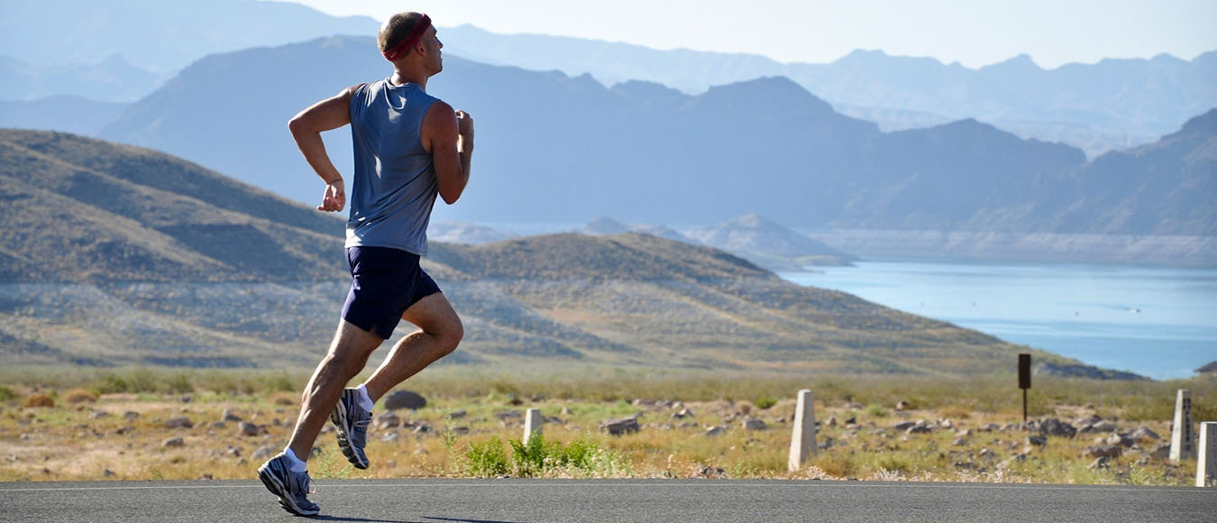 runner running down a road